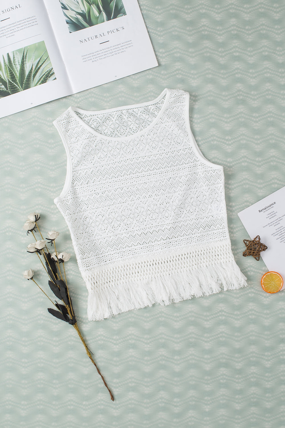 "Woman wearing a fringe tank top with tassel hem, ideal for festival outfits and casual boho style"
