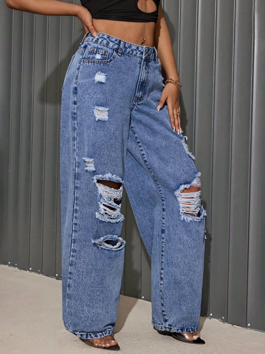 "She Wild Distressed Wide-Leg Jeans – High-waisted, edgy denim with bold distressing and a statement wide-leg fit for a fearless look."