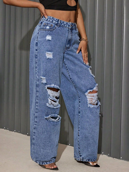 "She Wild Distressed Wide-Leg Jeans – High-waisted, edgy denim with bold distressing and a statement wide-leg fit for a fearless look."